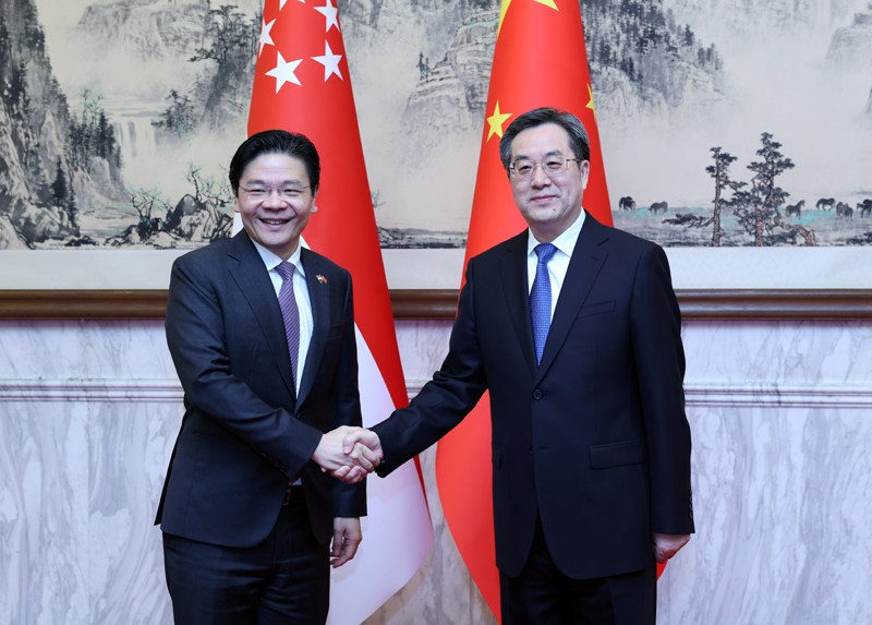 丁薛祥同新加坡副总理兼财政部长黄循财举行会谈「相关图片」